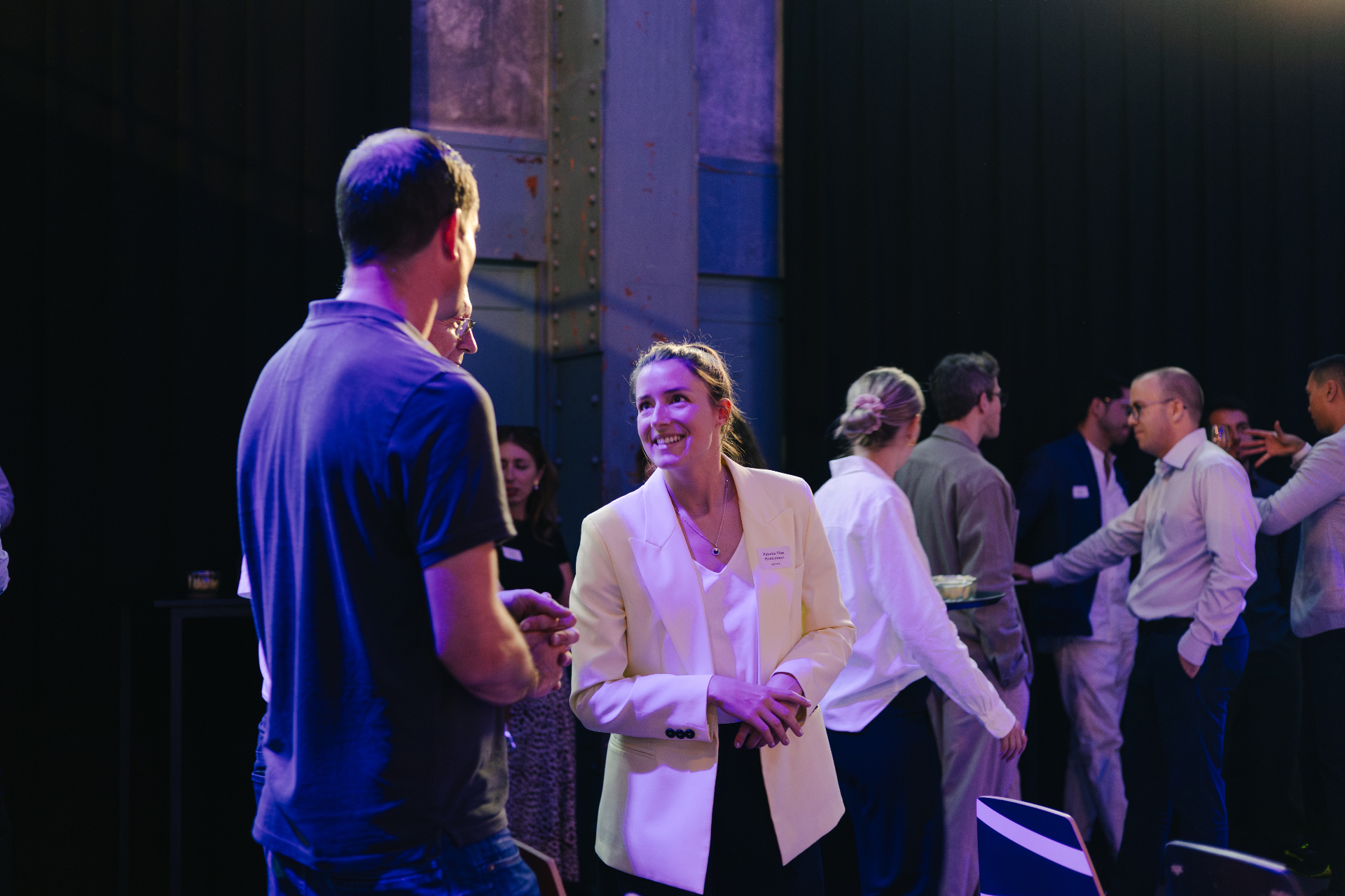 Business professionals collaborating during an AI Executive Connect networking event